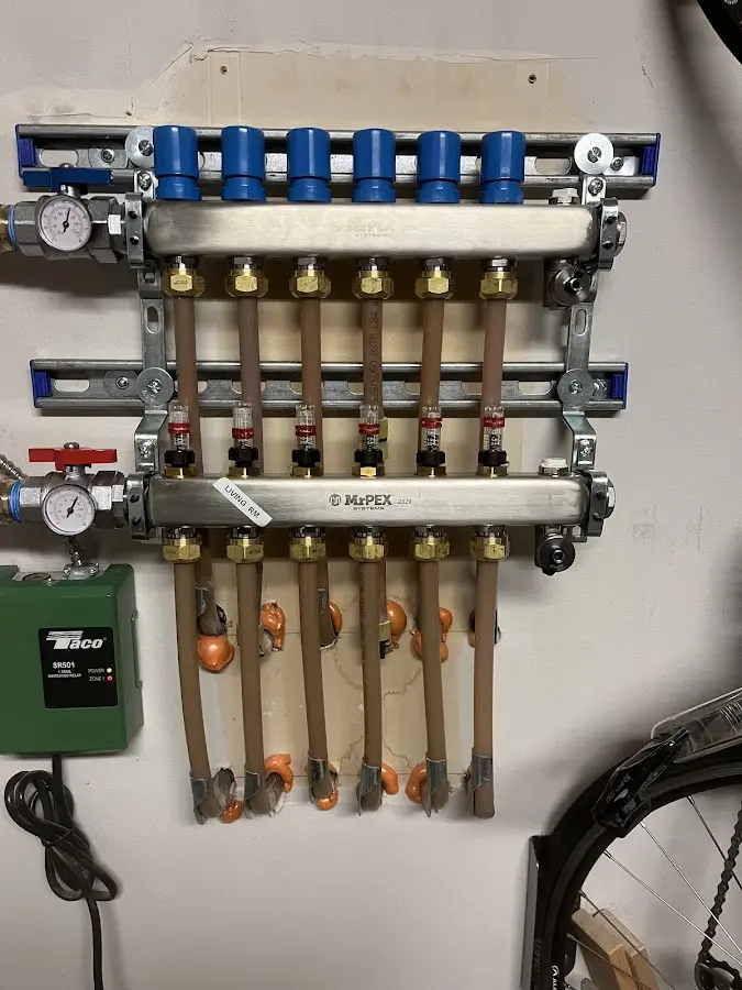 Plumber performing Water Heater Repair at a residential property in Waukon